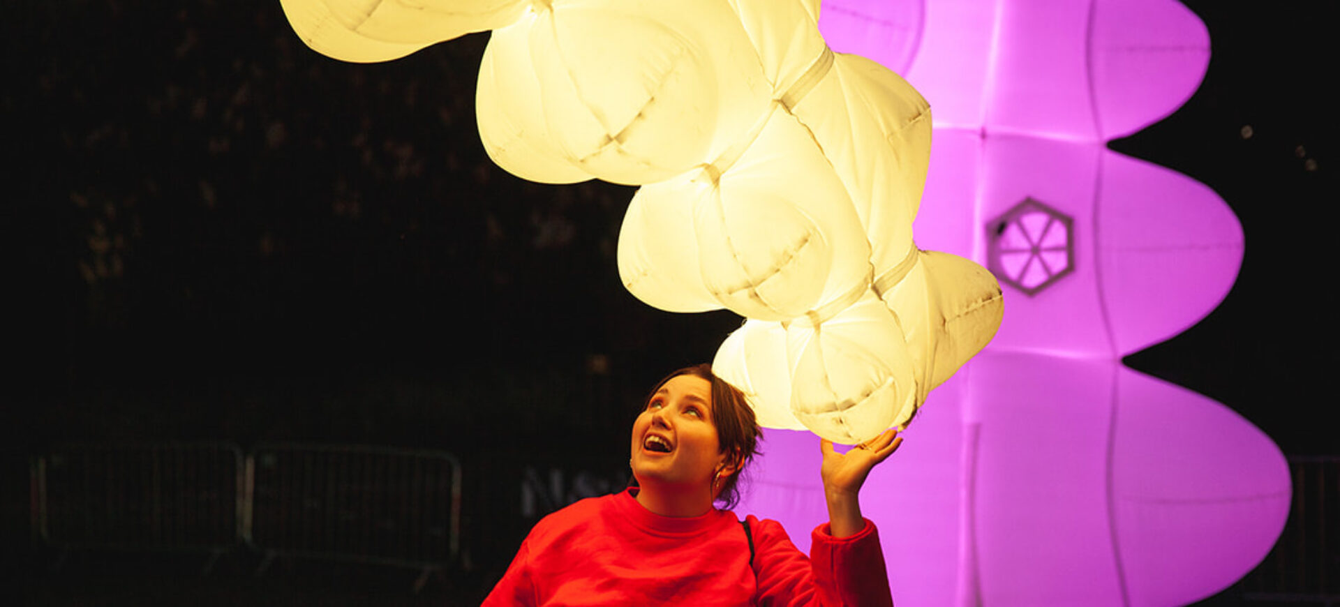 a woman interacting with one of Air Giant's soft robots