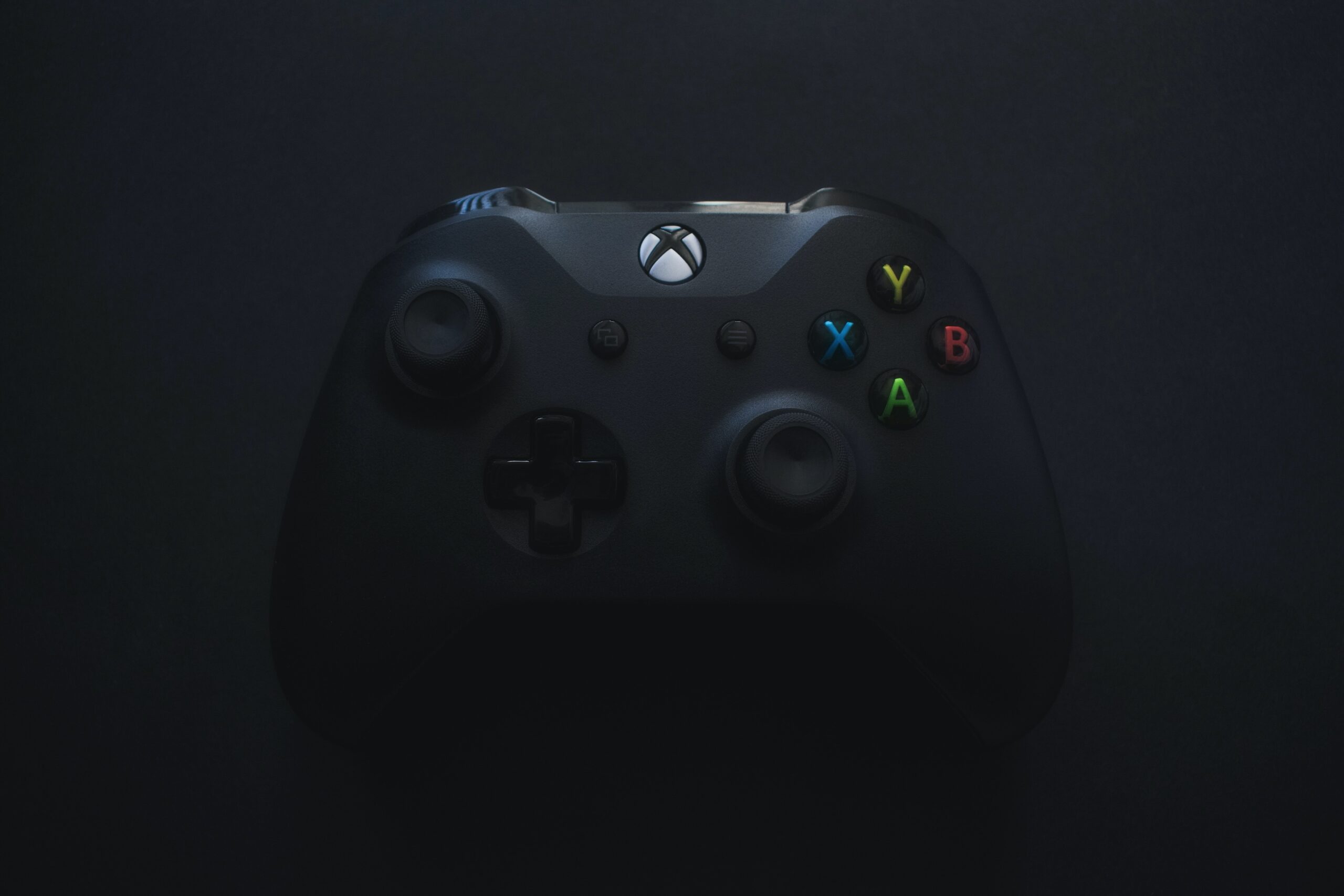 A Xbox controller in a darkened room