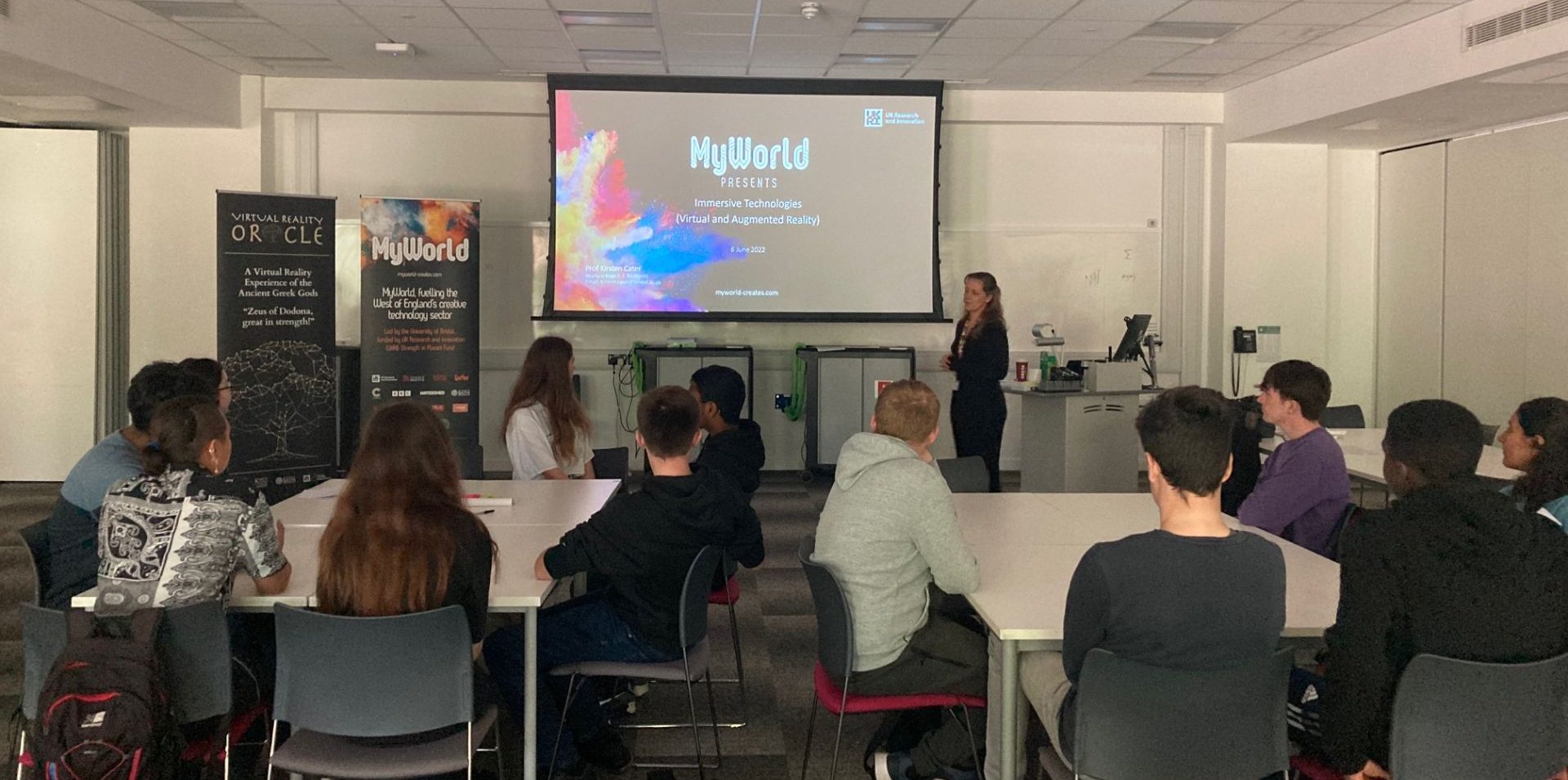 Students watching Ki Cater deliver presentation