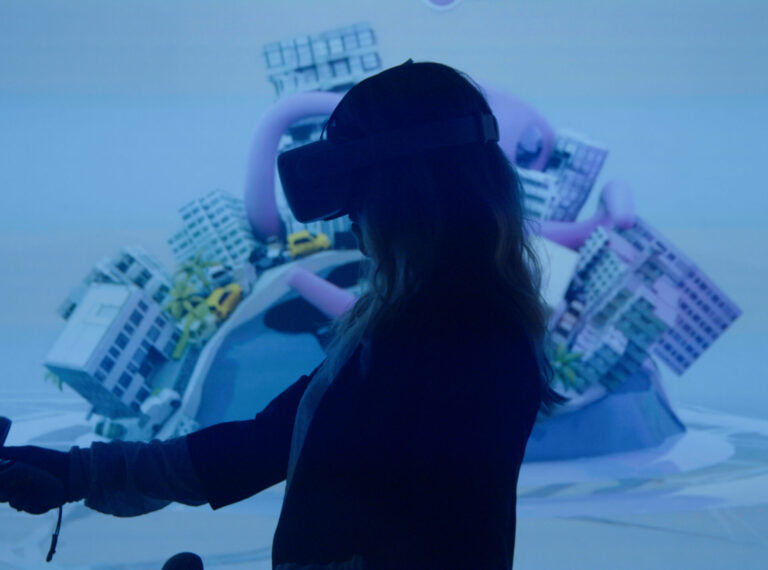silhouette of woman using VR head set and controller