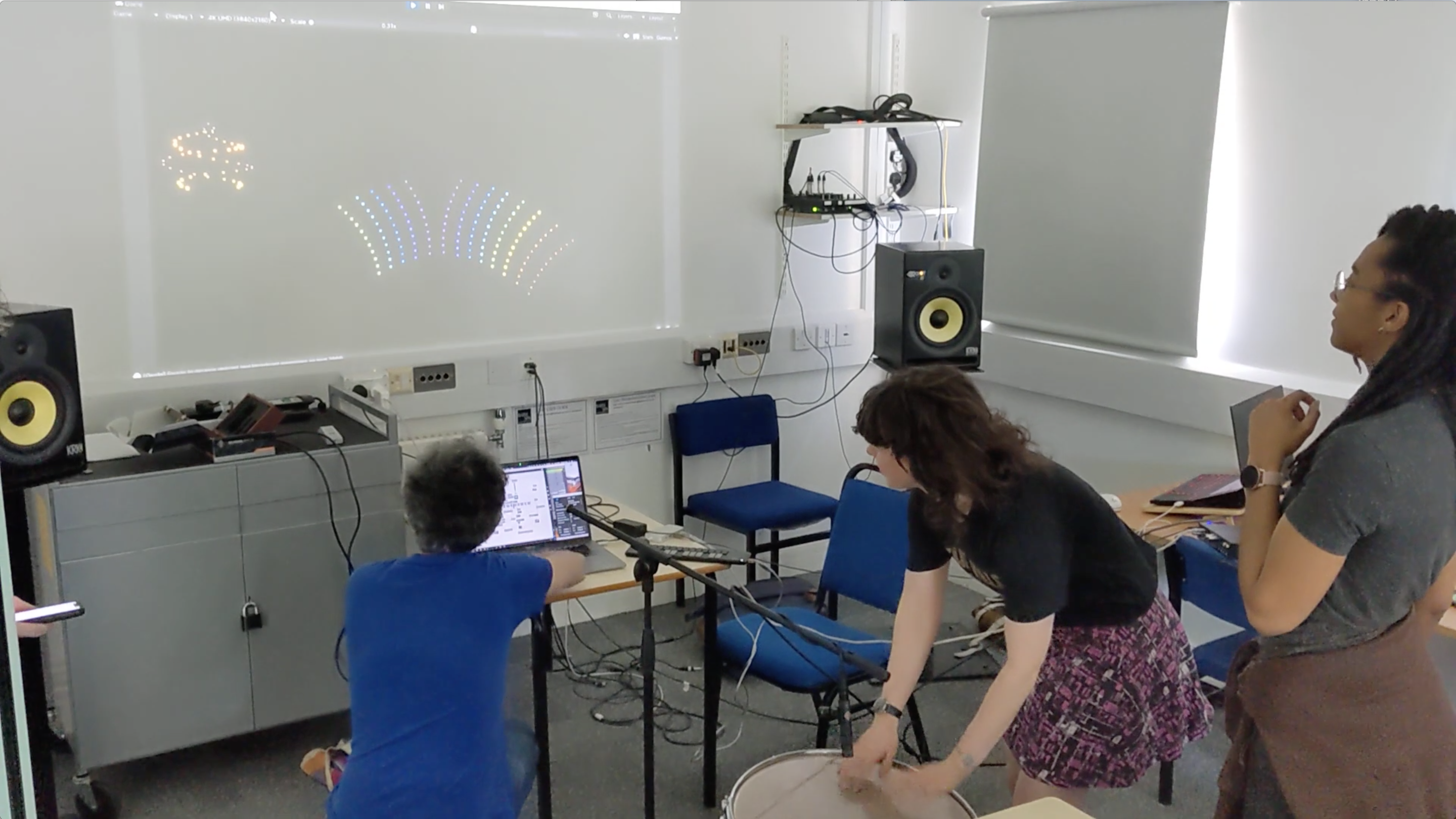 An image of three people taking part in a workshop.