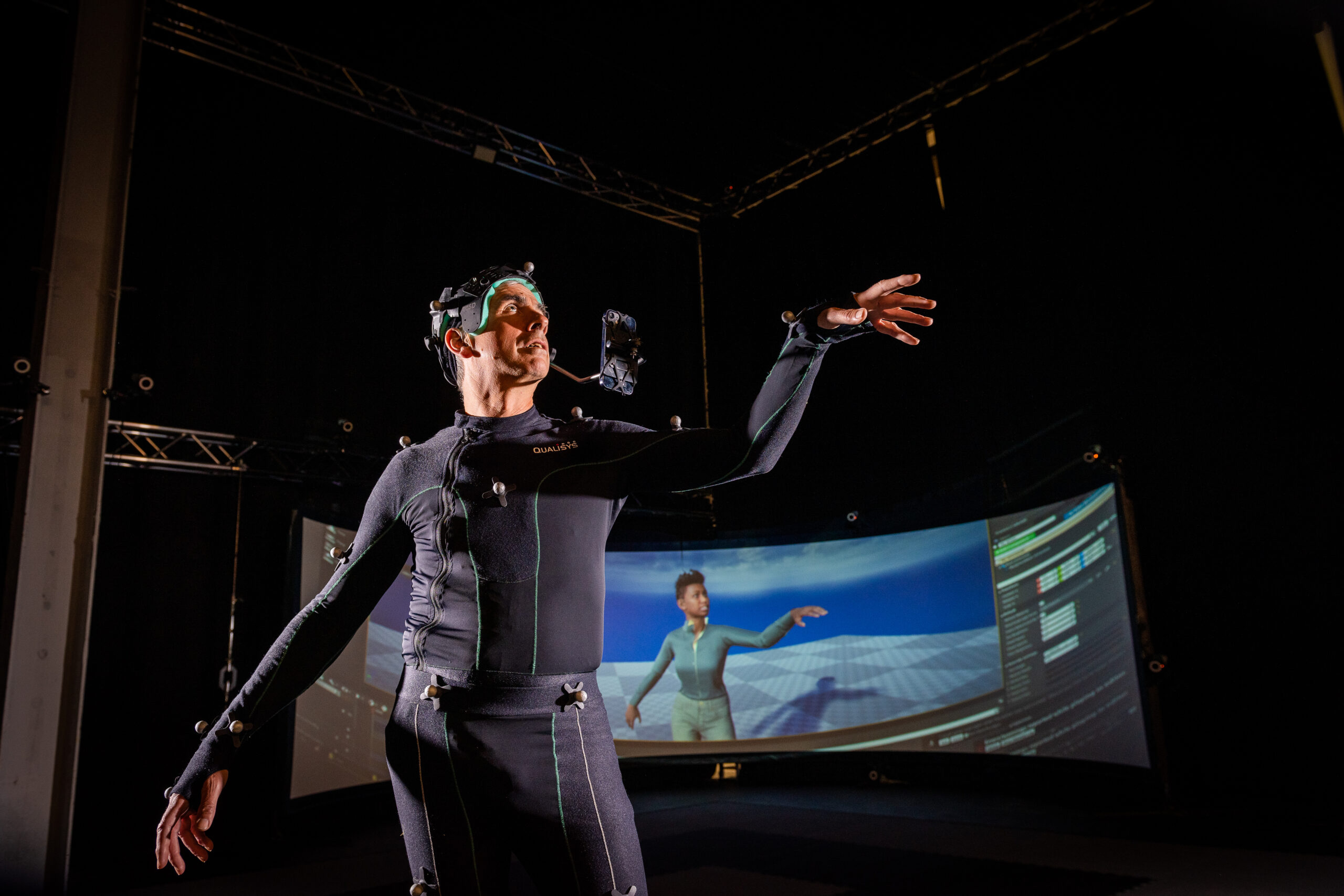 An image of a man in CAMERA's face and body light stage and photogrammetry rig.